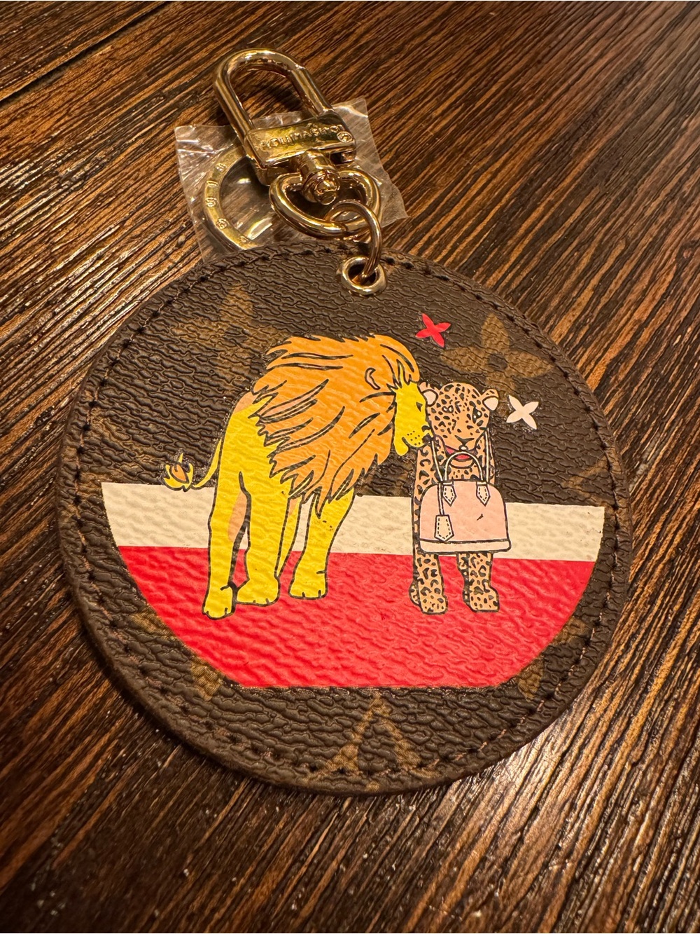 Designer Brown Monogram Round Keychain with Yellow Lion and Pink Leopard Graphic